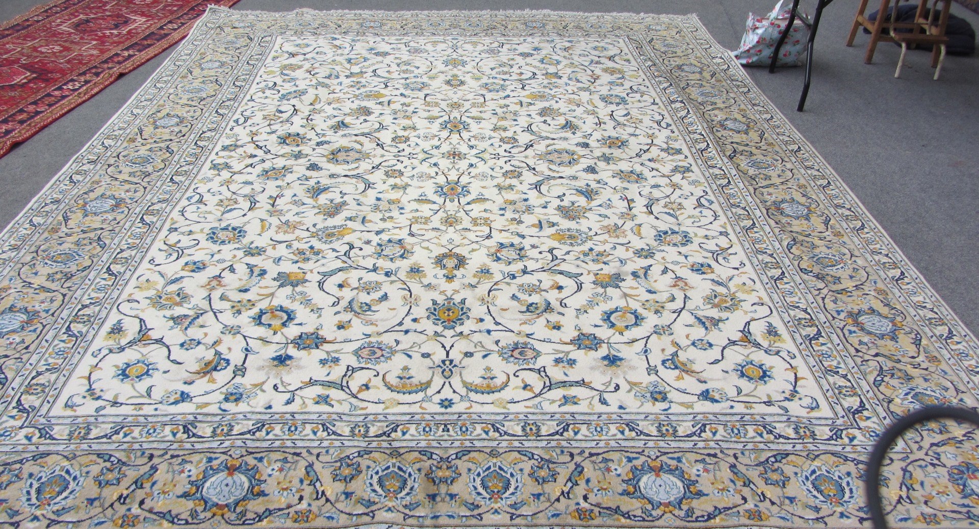 Appraisal: A Tabriz carpet Persian the ivory field with an allover