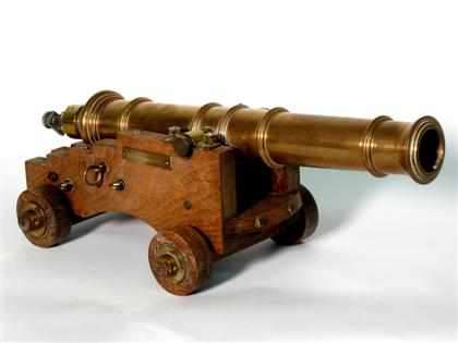 Appraisal: Bronze Naval cannon replica Style of On wooden carriage L