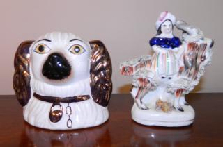 Appraisal: Staffordshire figurines Staffordshire figurines- Figural Bank of Spaniel Head Girl