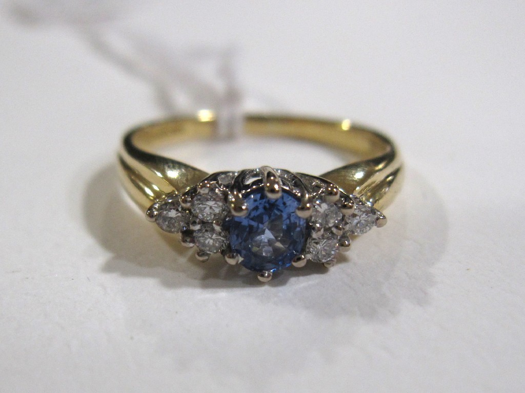 Appraisal: Eighteen carat gold Ceylon sapphire and diamond set dress ring