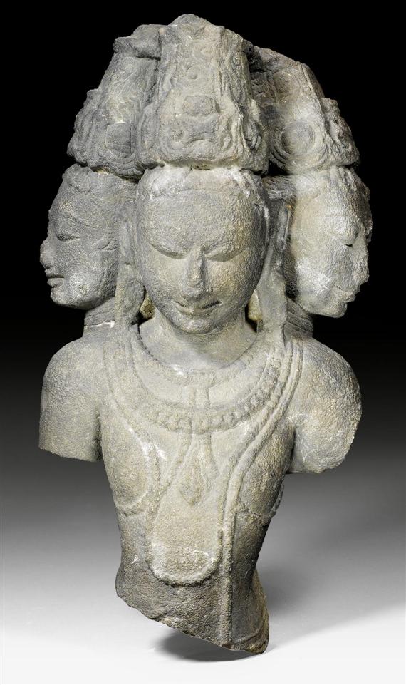 Appraisal: A RED SANDSTONE FIGURE OF SHIVA AS MAHESHA-MURTI Central India