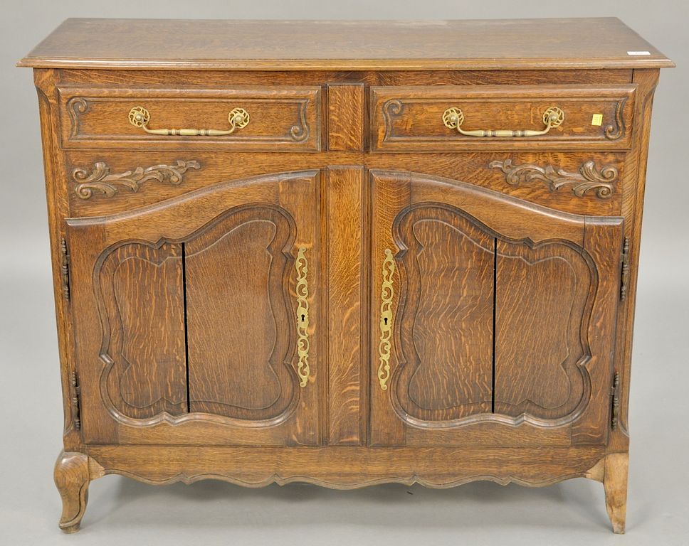 Appraisal: Carved oak server with two doors ht in wd in