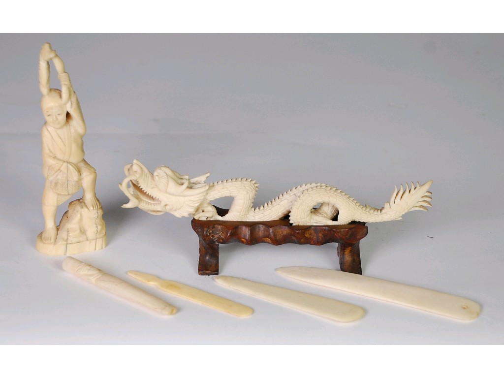 Appraisal: CHINESE CARVED IVORY MODEL OF A SNARLING FOUR TOED DRAGON