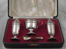 Appraisal: A boxed three piece silver cruet set comprising salt pepper