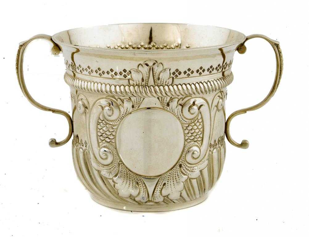 Appraisal: A WILLIAM III REPLICA CUP partially lobed and fluted and