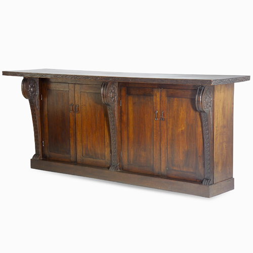 Appraisal: MARIE ZIMMERMANN Hand-carved work bench with twisted metal pulls adjustable