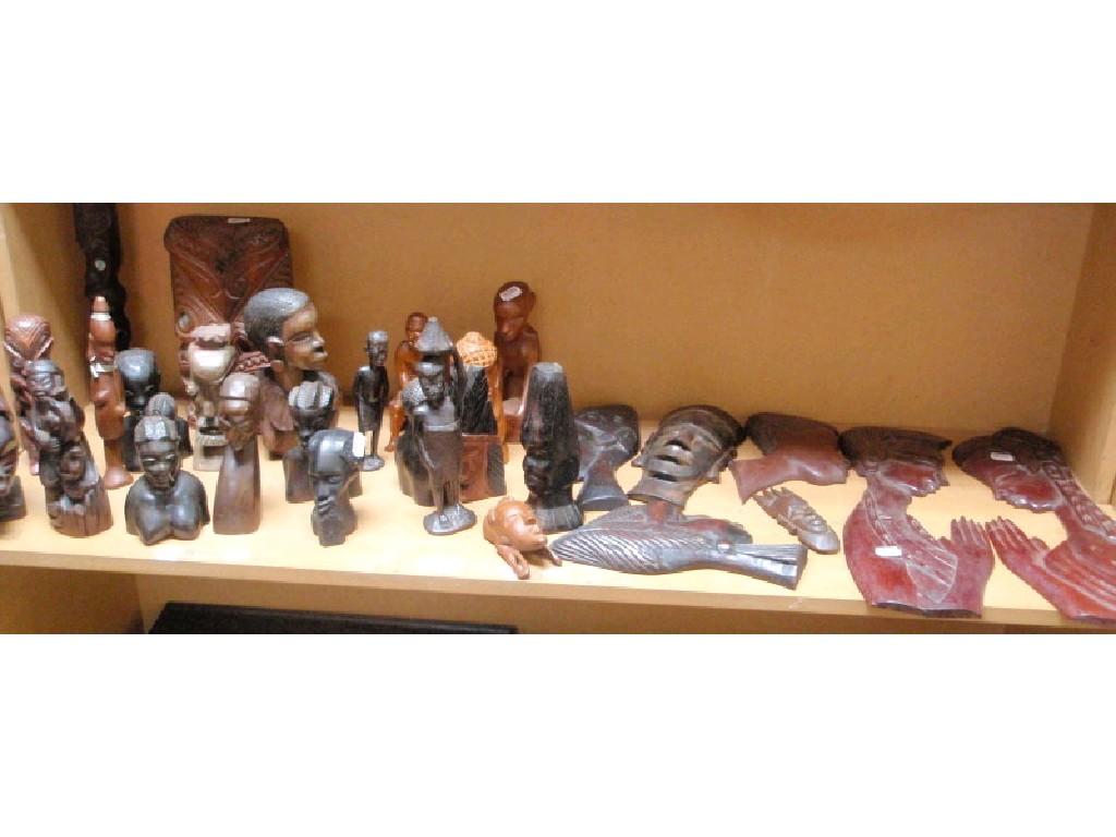 Appraisal: A collection of African tribal carved hardwood busts and figures