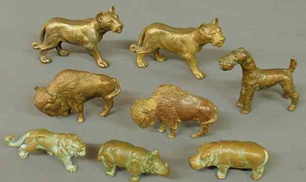 Appraisal: Eight bronze and bronze-type animals two lions h x l