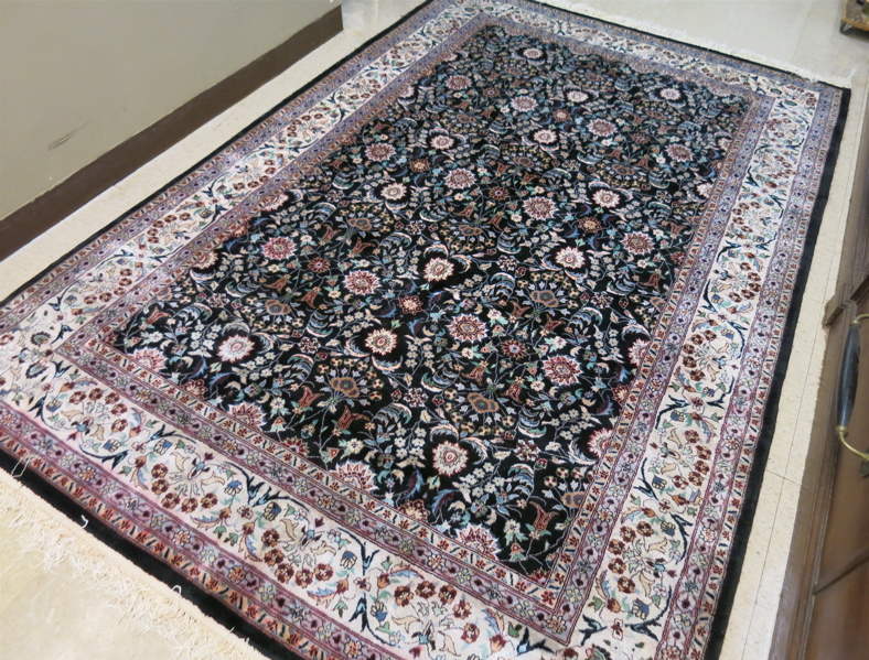 Appraisal: HAND KNOTTED ORIENTAL CARPET Indo-Persian overall floral design on rectangular