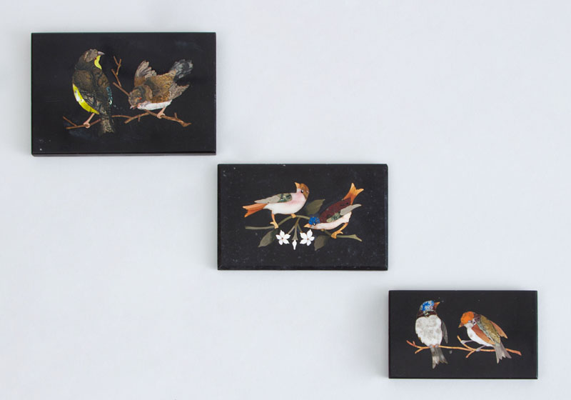 Appraisal: THREE FLORENTINE PIETRA DURA PLAQUES Each showing two birds on