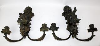 Appraisal: Pair of cast iron arm sconces with cherub Pair of