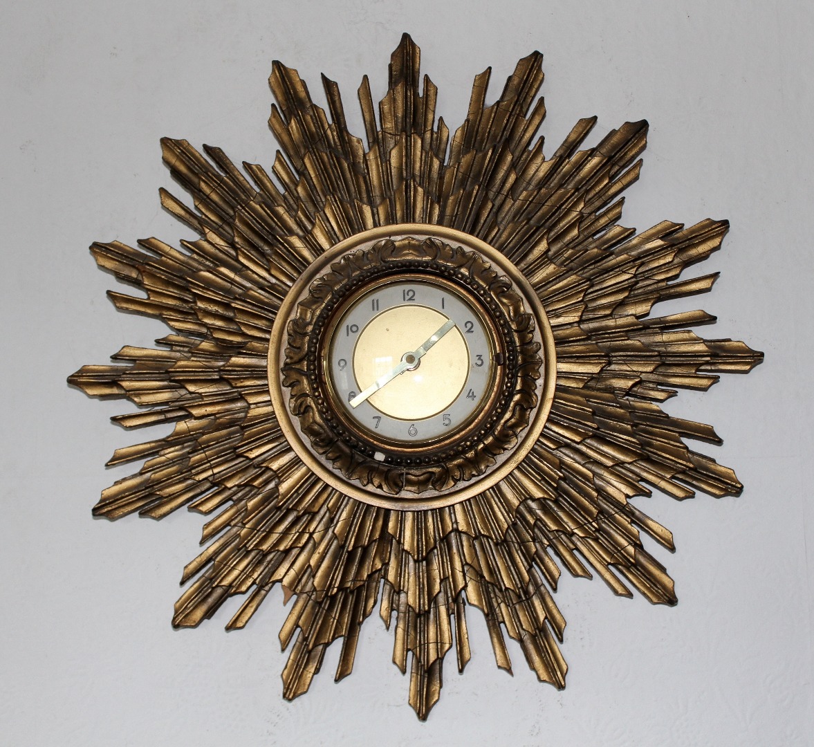 Appraisal: A mid thC gilt sunburst wall clock now with quartz