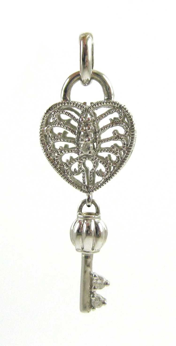 Appraisal: DIAMOND AND FOURTEEN KARAT WHITE GOLD PENDANT The white gold