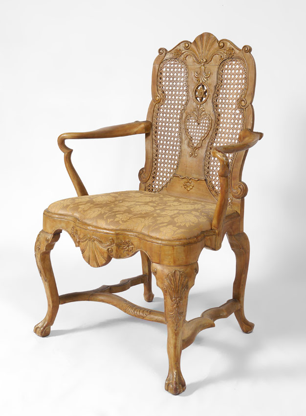 Appraisal: FRENCH STYLE CARVED ARM CHAIR Carved pierced and caned back