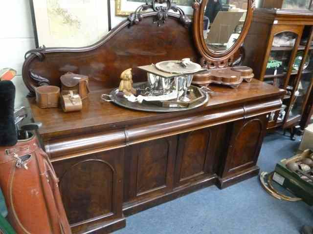 Appraisal: A VICTORIAN AND MAHOGANY BREAK FRONT SIDEBOARD with carved raised