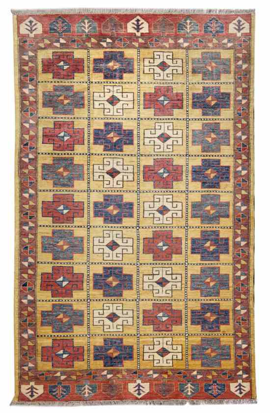 Appraisal: A Kazak Wool Rug having repeating geometric medallions on a