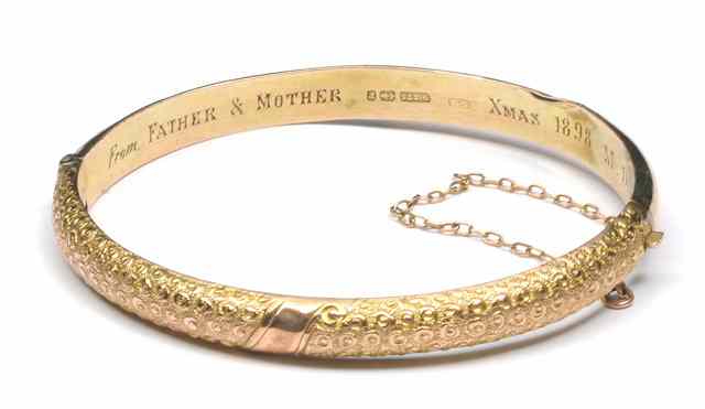 Appraisal: A VICTORIAN CT GOLD HINGED BANGLE with engraved textured finish