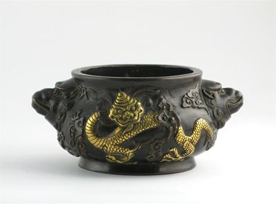 Appraisal: A Chinese bronze censer cast in relief with scaly dragons