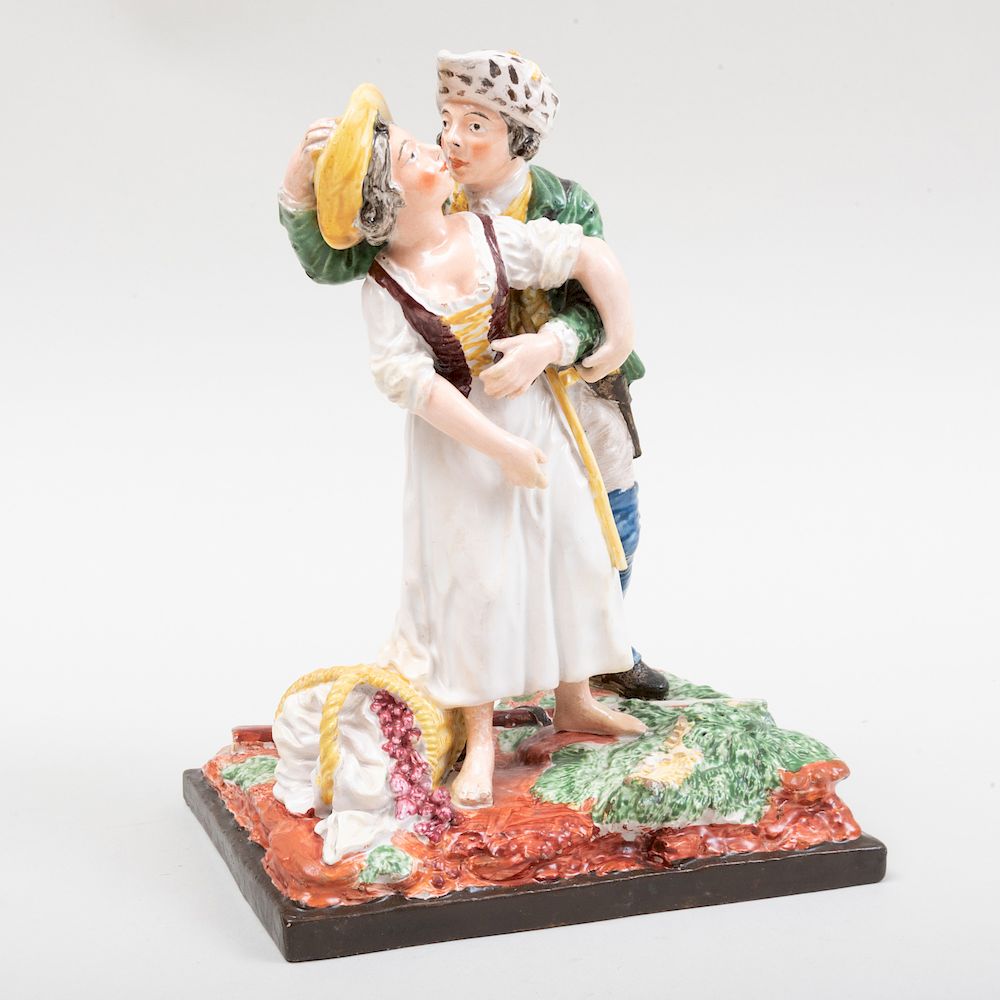 Appraisal: Continental Faience Figure Group of a Soldier and a Maiden