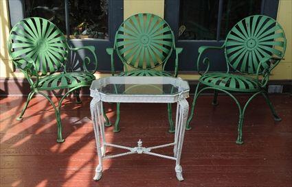 Appraisal: THREE GREEN-PAINTED METAL GARDEN ARMCHAIRS Each with round back and