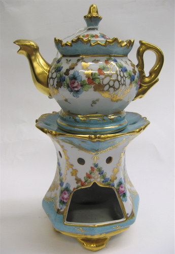 Appraisal: FRENCH TWO-PART PORCELAIN VEILLEUSE hand decorated with multi-colored floral and