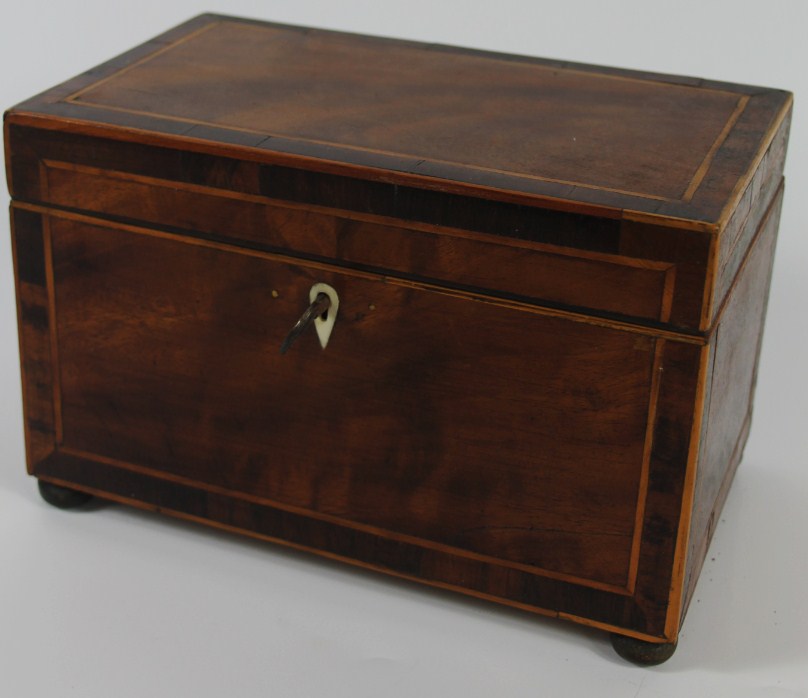 Appraisal: A George III flame mahogany three sectional tea caddy with