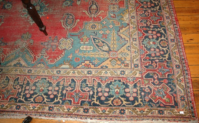 Appraisal: A LARGE PERSIAN KASHAN PATTERN CARPET Having a red ground