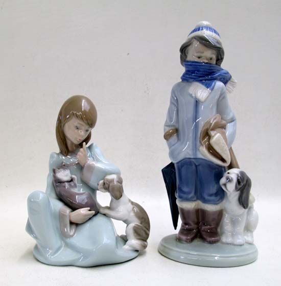 Appraisal: TWO LLADRO PORCELAIN FIGURINES Cat Nap and Boy Wrapped in