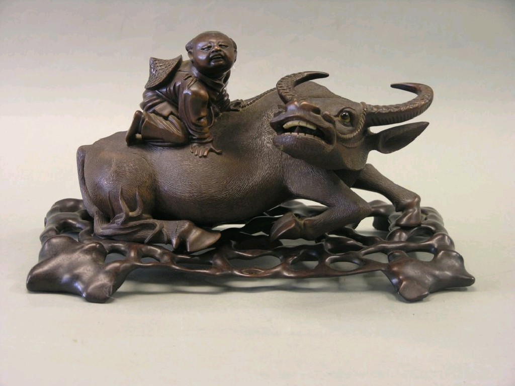 Appraisal: A Chinese wood carving water buffalo at rest fine carving