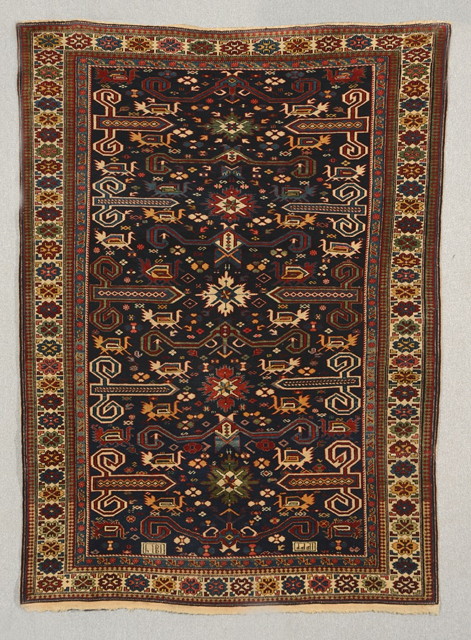 Appraisal: A CAUCASIAN PEREPEDIL BLUE GROUND RUG with an intricate design