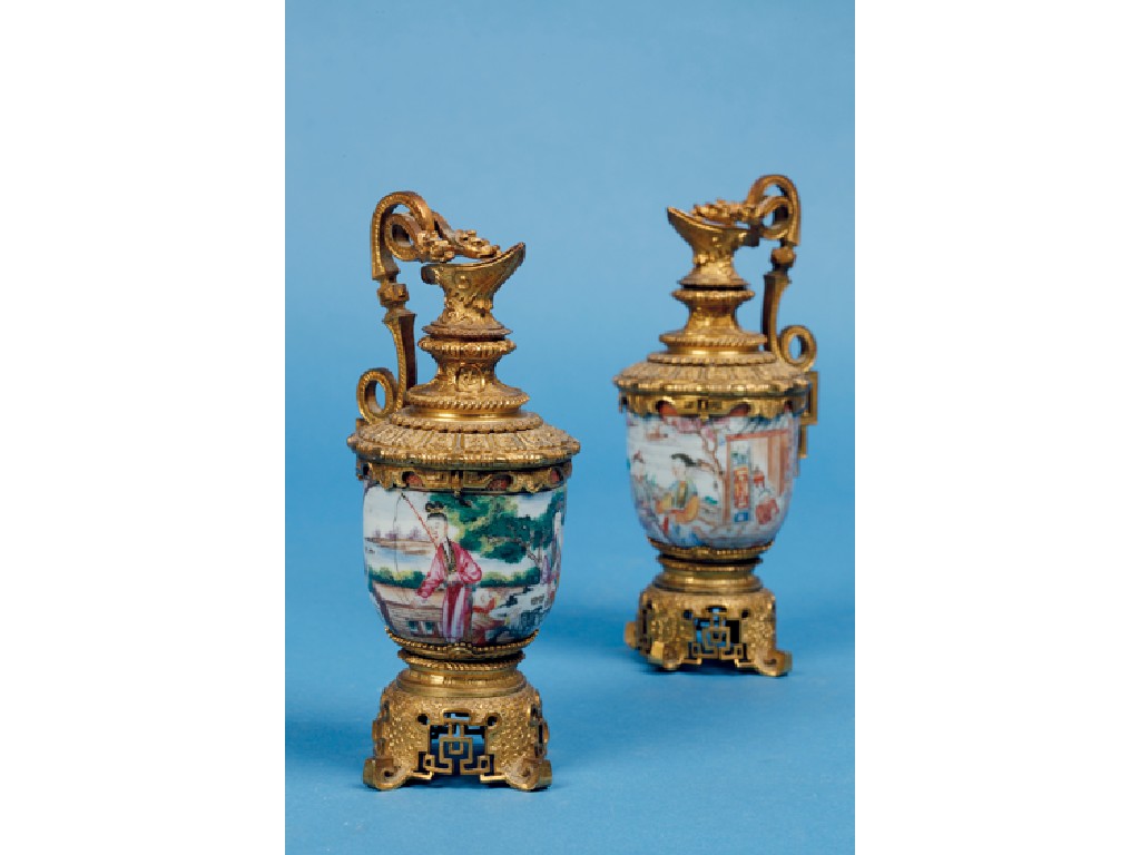 Appraisal: A PAIR OF CHINESE EXPORT FAMILLE ROSE CUPS later mounted