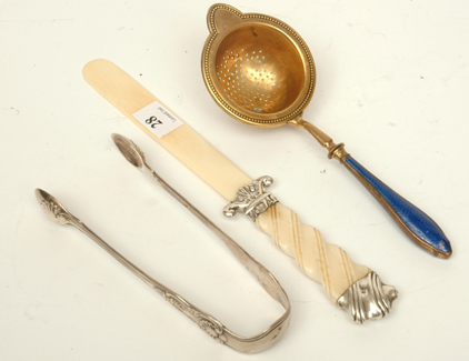 Appraisal: AN ENAMELLED STRAINER AN IVORY AND SILVER LETTER OPENER AND