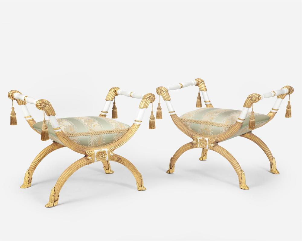 Appraisal: A pair of French-style carved giltwood curule seats th Century