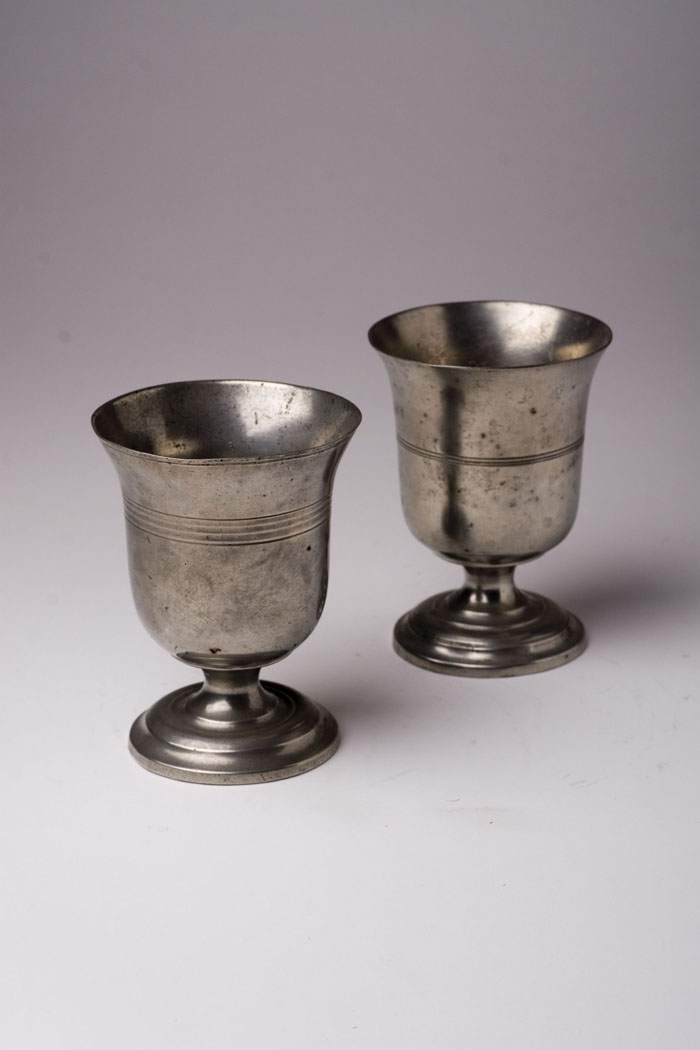 Appraisal: PAIR OF PEWTER FOOTED BEAKERS ATTRIBUTED TO MERIDEN BRITANNIA COMPANY