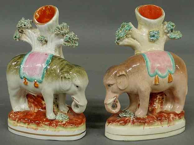 Appraisal: Rare pair of th c Staffordshire standing elephant spill vases