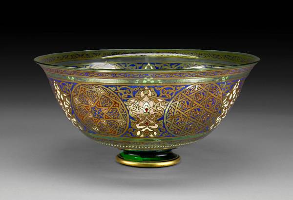 Appraisal: A Brocard style Persian inspired enameled green tinted glass bowl