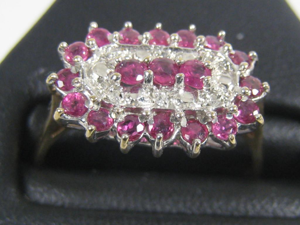 Appraisal: A Ruby and Diamond Ring pav -set three central circular-cut