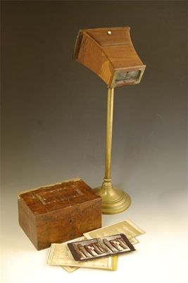 Appraisal: A rosewood veneered Brewster type stereoscope on an adjustable brass