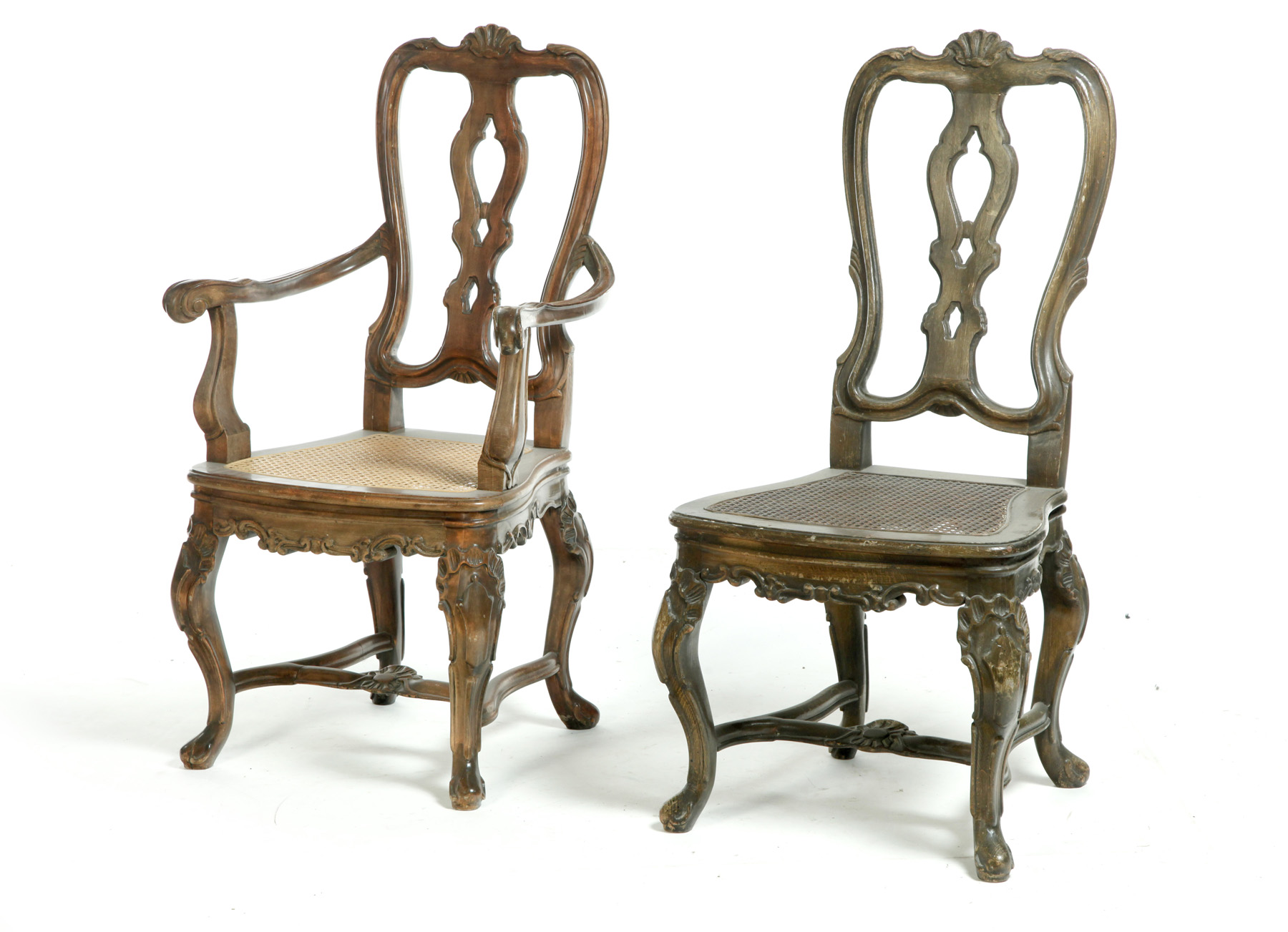 Appraisal: SEVEN HEAVILY CARVED SIDE CHAIRS Spain th century Two arms