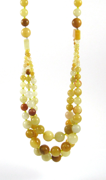 Appraisal: BUTTER JADE BEAD NECKLACE with a single strand and three