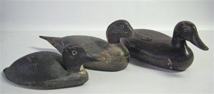 Appraisal: Three carved and painted decoys th century Including a laminated