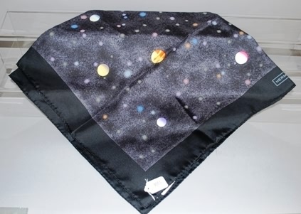 Appraisal: black solar system Approx size x Neiman Marcus price tag