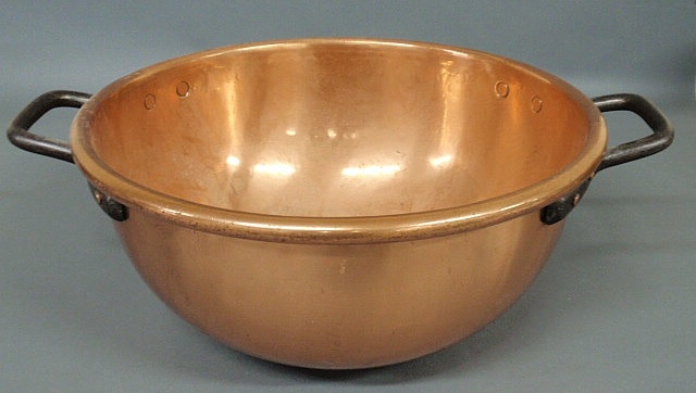 Appraisal: Large polished copper bowl th c with wrought iron handles