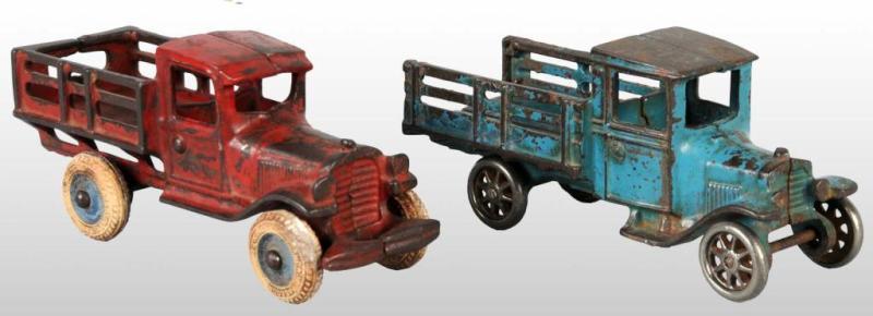 Appraisal: Lot of Cast Iron Arcade Stake-Back Truck Toys Description Includes