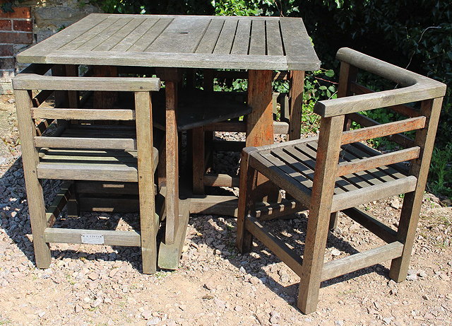 Appraisal: R A LISTER TEAK SQUARE GARDEN TABLE with four nesting