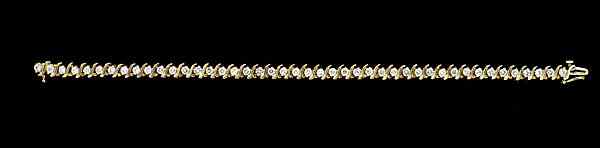 Appraisal: Diamond Tennis Bracelet A ladies' k yellow gold prong-set bracelet