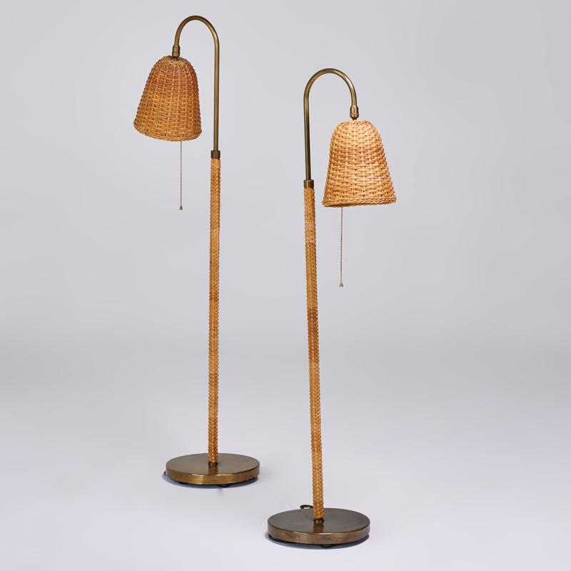 Appraisal: MODERN Pair of adjustable floor lamps USA s Rattan wicker