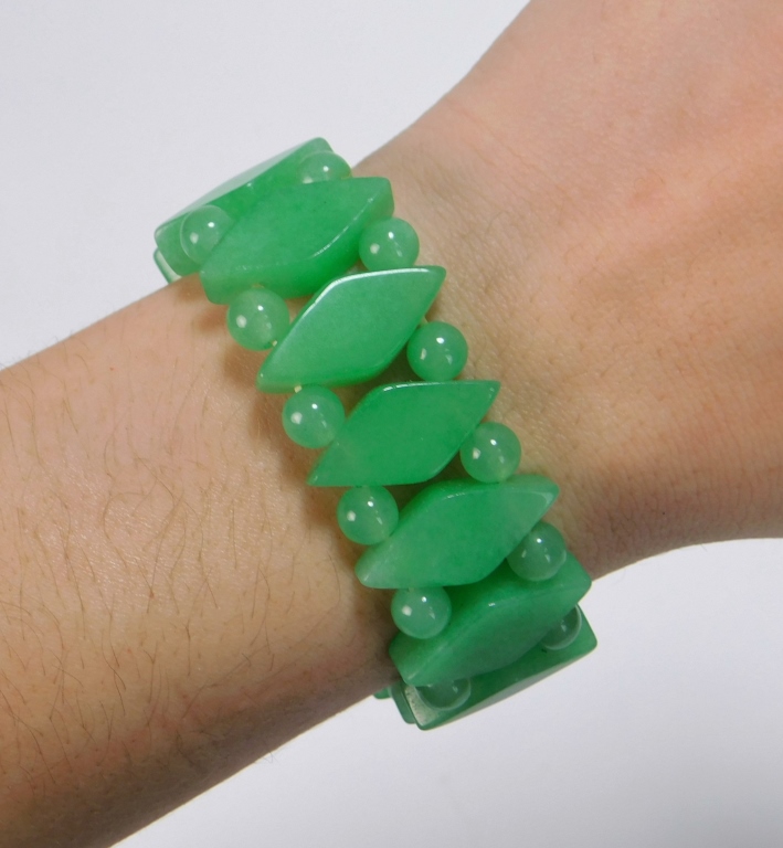 Appraisal: CHINESE CARVED JADEITE BRACELET China th CenturyDouble strand of beads