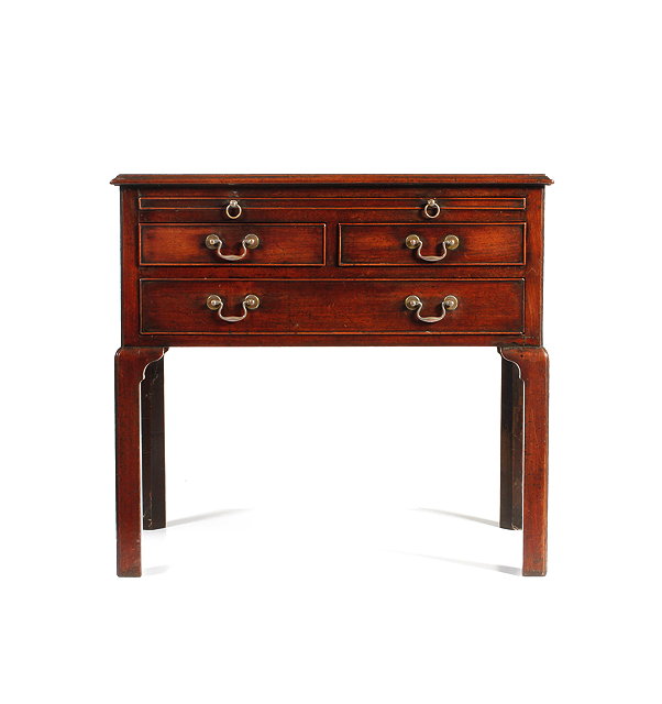 Appraisal: A GEORGE III MAHOGANY SIDE TABLE with brushing slide above