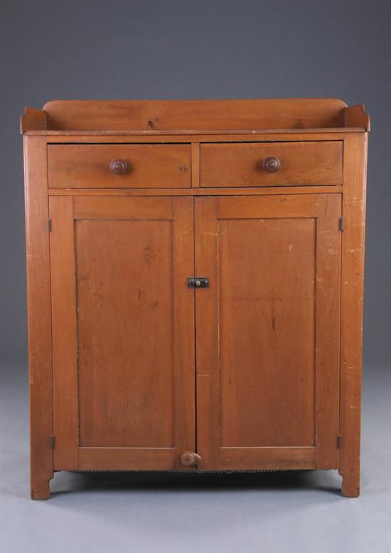 Appraisal: AMERICAN COUNTRY CUPBOARD th century with orange-wash stain Rectangular top